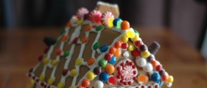 Macro photo of colorfully decorated gingerbread house adorned with candies of various types