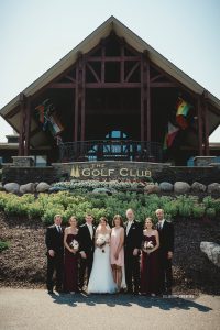 Wedding party in front of the Golf Club at Madden's on Gull Lake