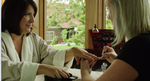 Woman getting nails painted at the Spa at Madden's on Gull Lake