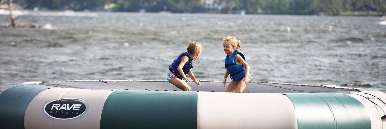 Little girls playing inside a water raft