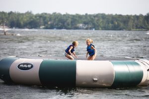 Little girls playing inside a water raft