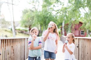 Three little girls eating ice cream