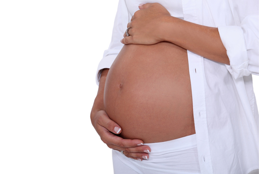 pregnant woman touching her belly