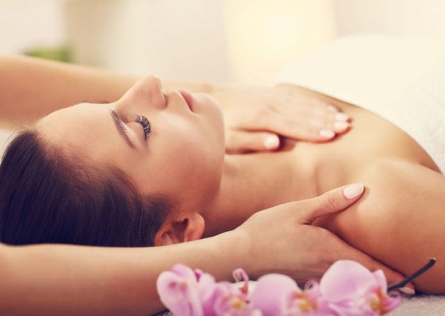 Woman receiving massage in spa