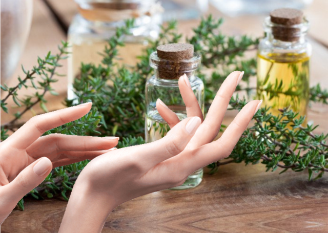 hands applying essential oils