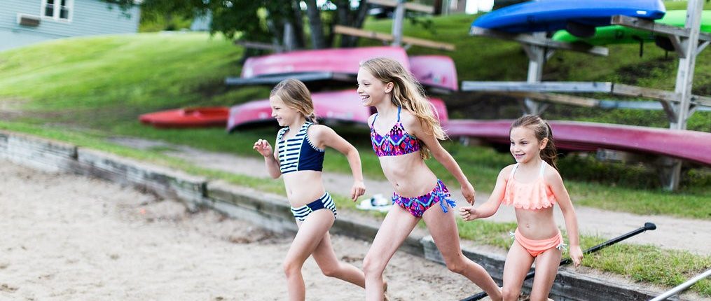 Three girls walking on the beach