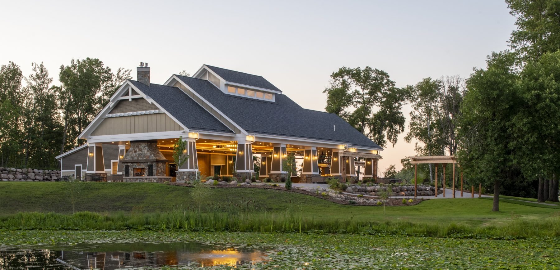 Maddens Pavilion building exterior facing a pond