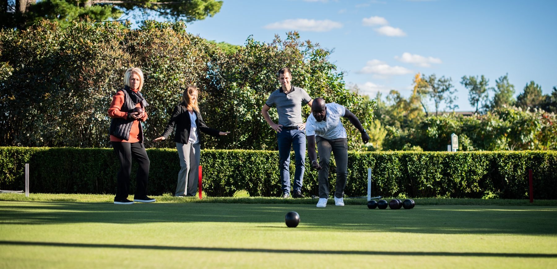 Group of people bowling outdoors