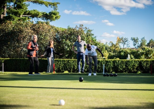 Group of people bowling outdoors