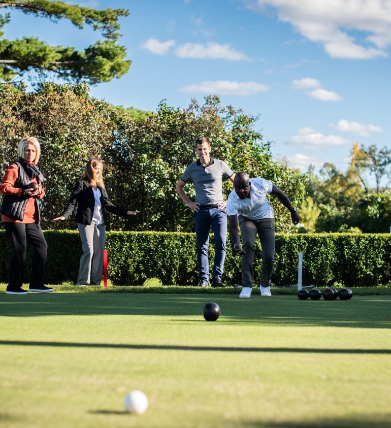 Group of people bowling outdoors