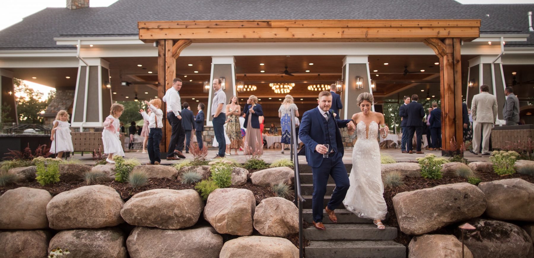 Bride and groom walking down the stairs at the Pavilion