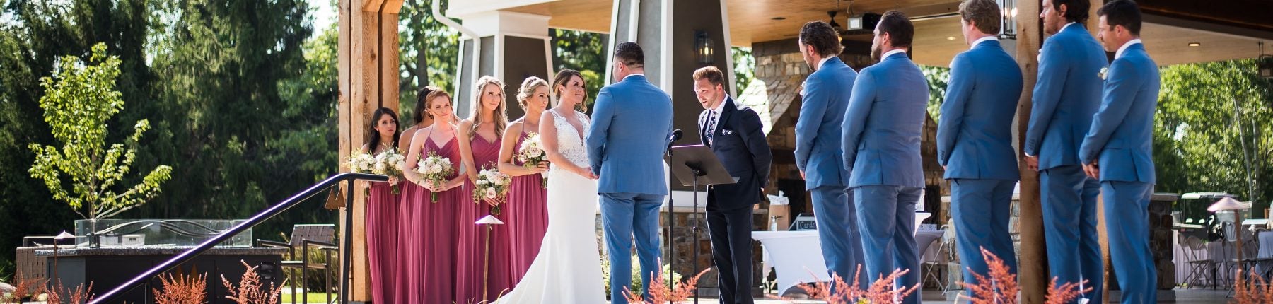 Bride and groom with their groomsmen and bridesmaids on the aisle at The Pavilion