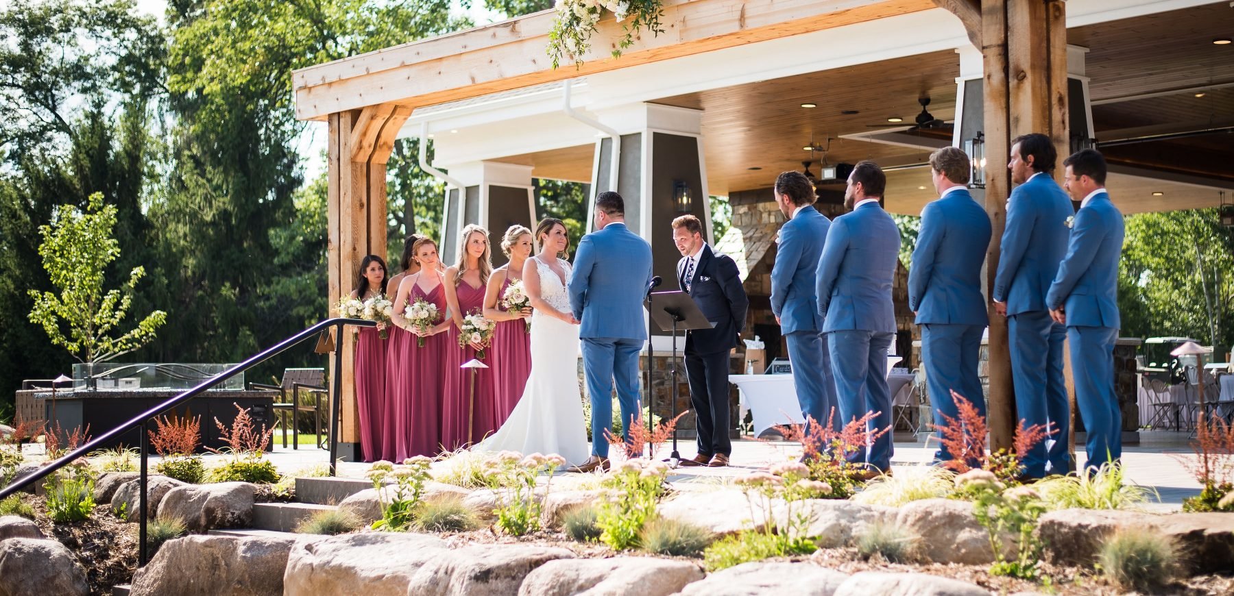 Bride and groom with their groomsmen and bridesmaids on the aisle at The Pavilion