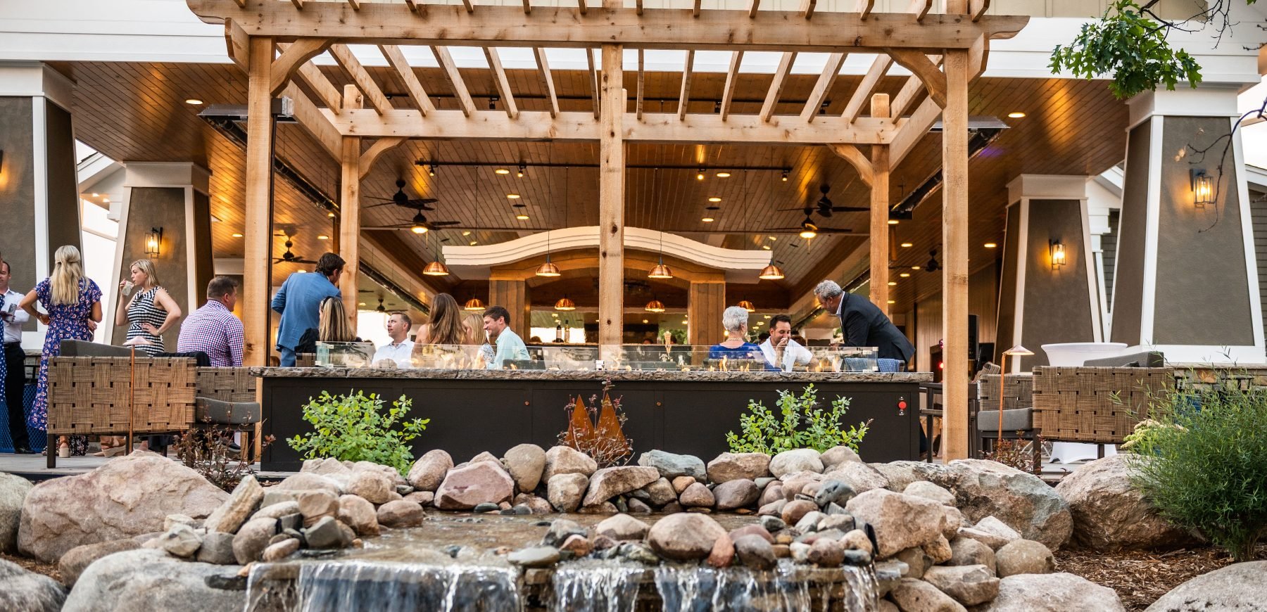 Guests seated in the outdoor patio area in the Pavilion