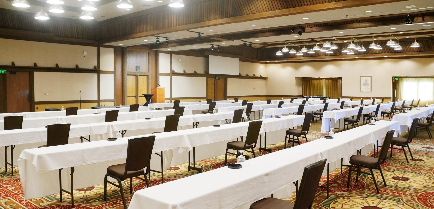 governors ballroom set up with long tables and chairs placed at a social distance