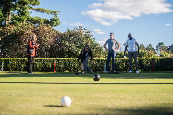 group of people lawn bowling