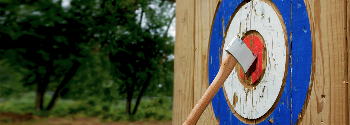 axe stuck in bullseye of wooden target