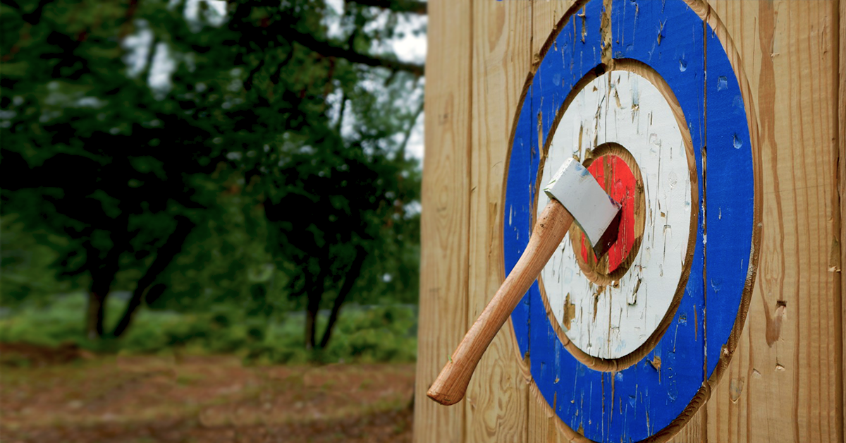 axe stuck in bullseye of wooden target