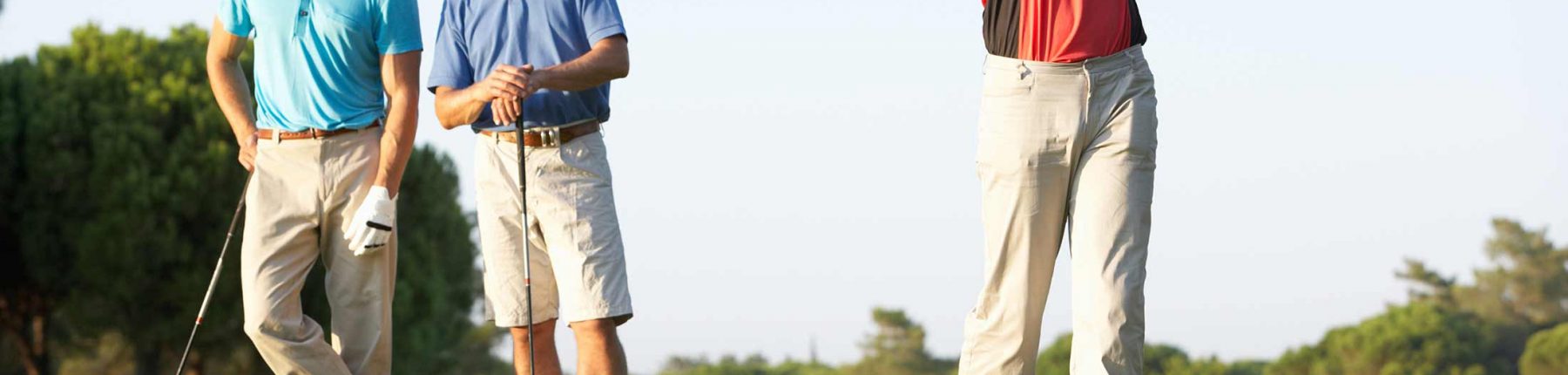 3 men playing golf