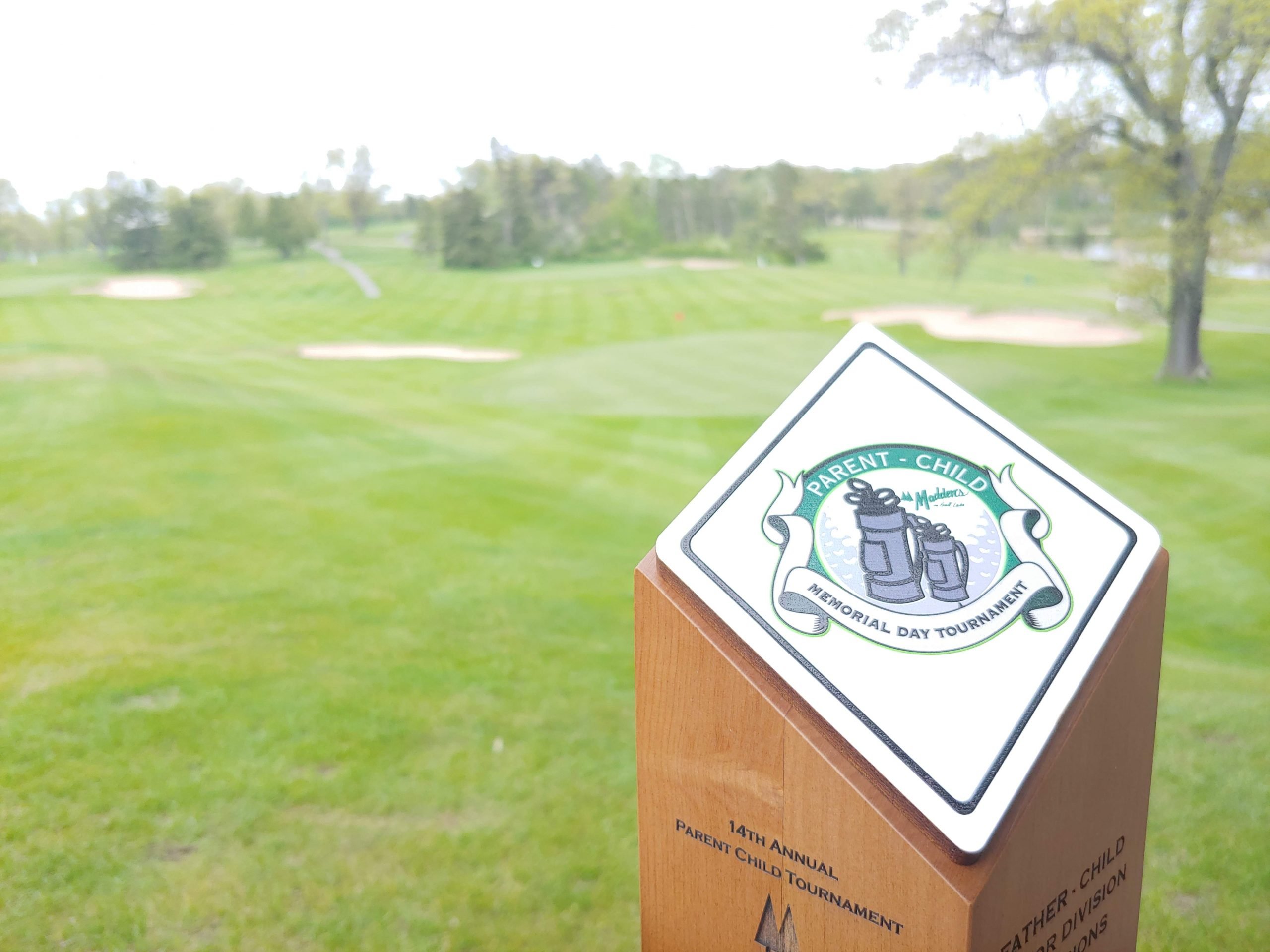 parent child memorial day tournament award on golf course