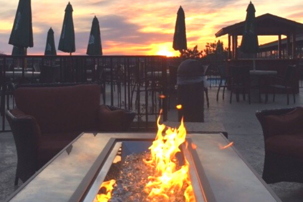 fire within a table outside on a deck