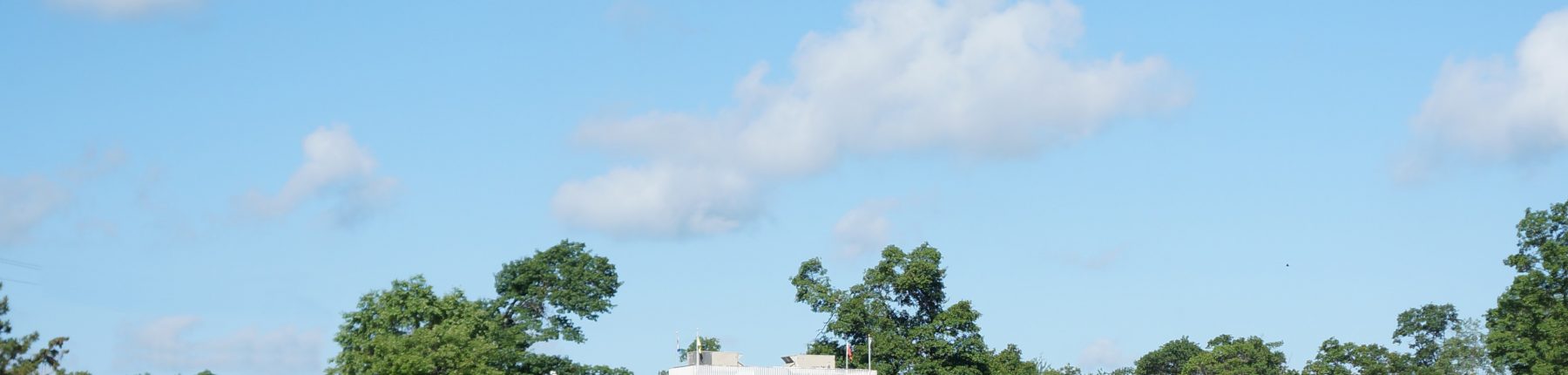 tennis and croquet building across lagoon