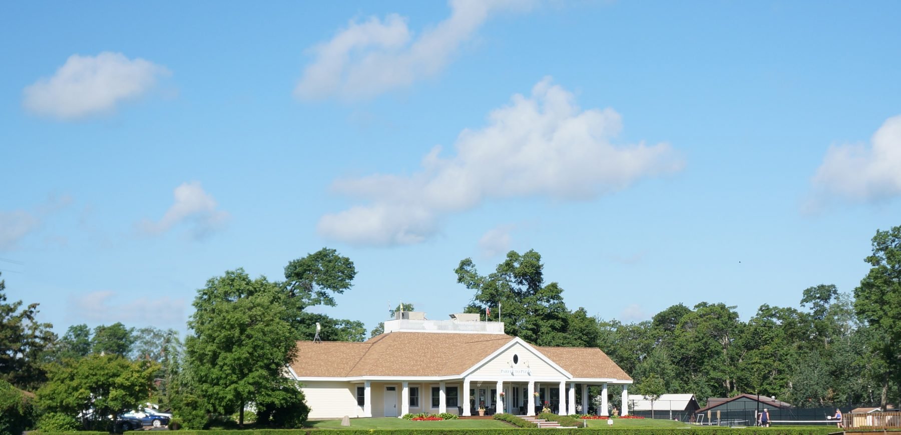 tennis and croquet building across lagoon