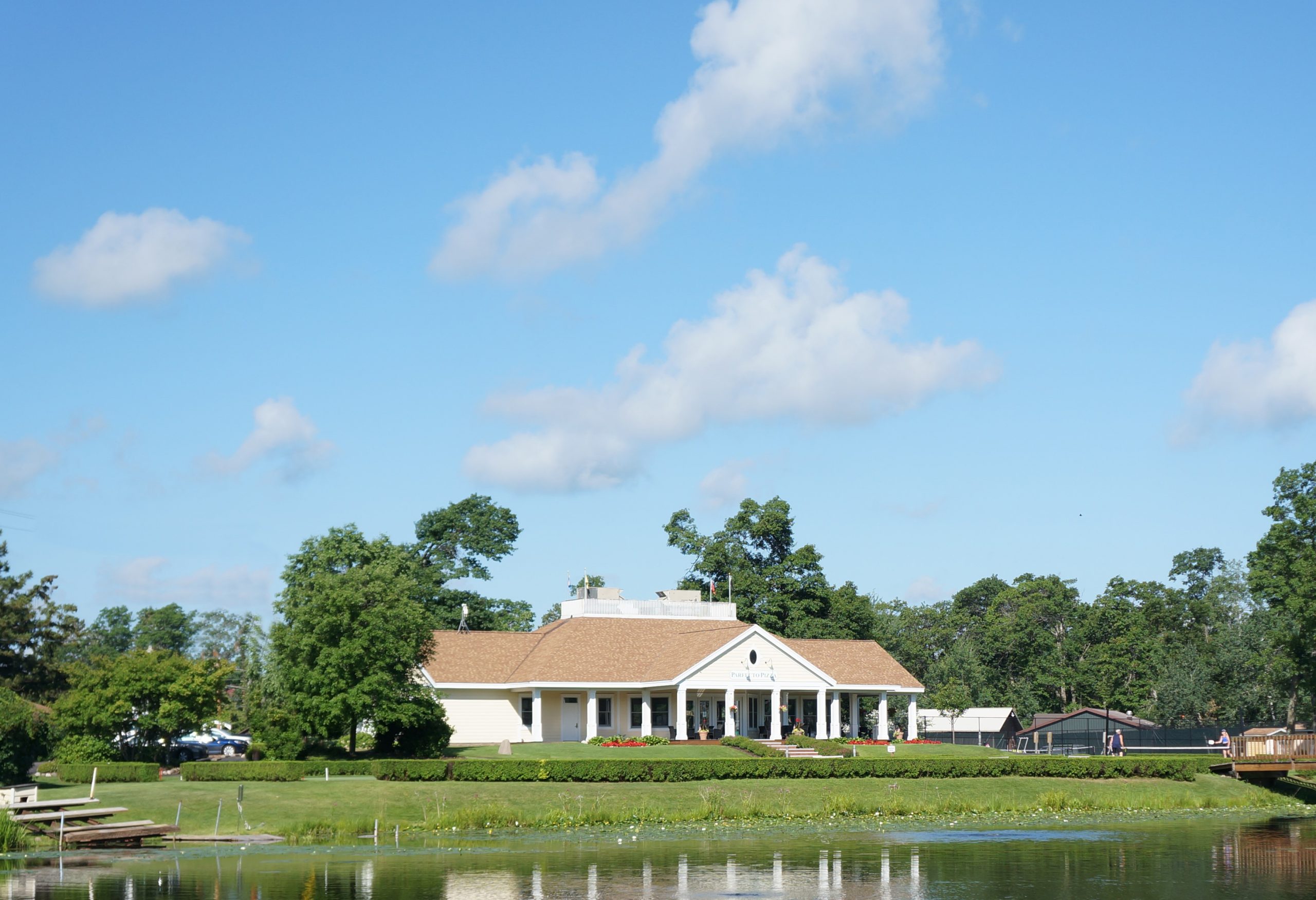 tennis and croquet building across lagoon