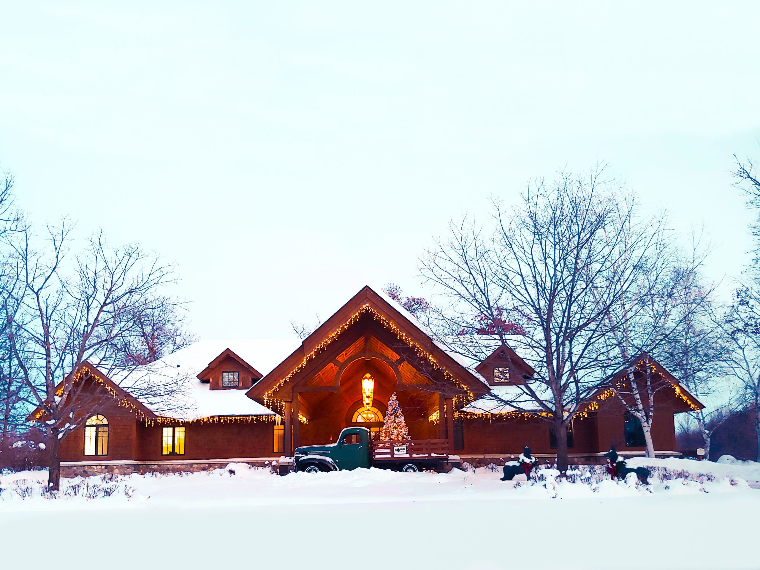 Madden's on Gull Lake at Christmas time covered in lights and snow