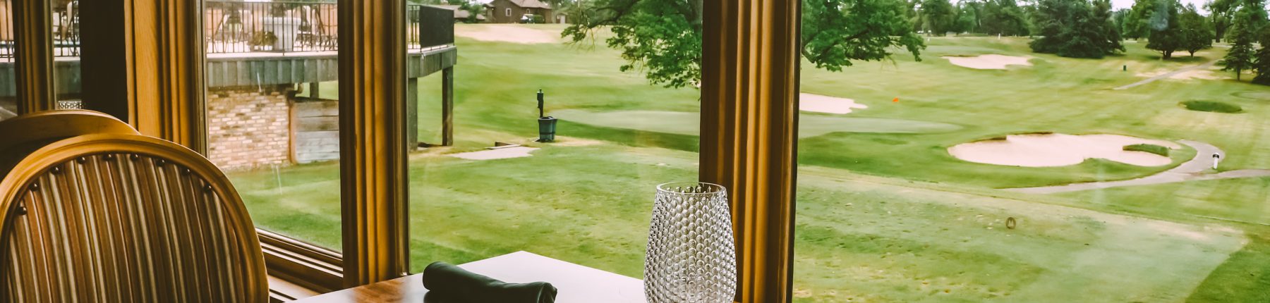 menu open on table overlooking golf course